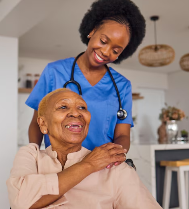 Caregiver smiling with an older adult client